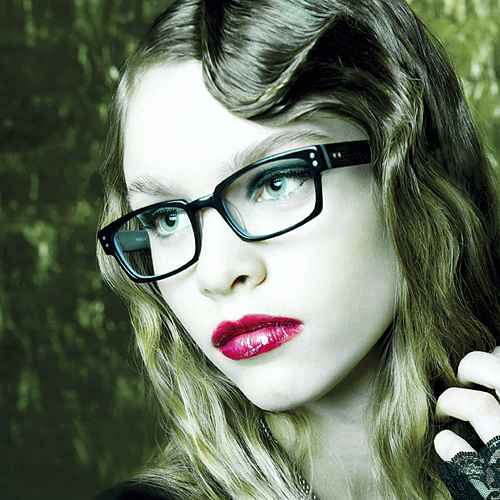 Woman wearing stylish glasses / eyeglass frames.
