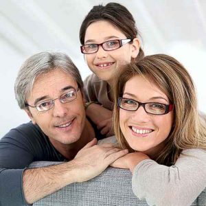 Our promise to you and your family. Mother, father and daughter all wearing glasses.