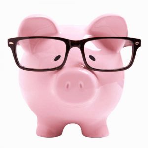 Savings. Piggy bank with glasses.